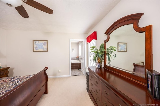 430 Rose Rd, Newton Grove, NC 28366 - bedroom featuring light carpet, baseboards, a ceiling fan, and connected bathroom