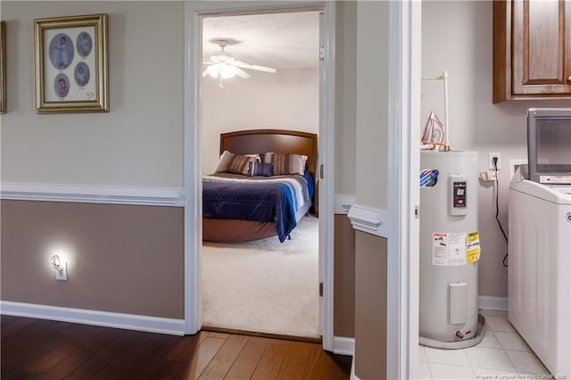 430 Rose Rd, Newton Grove, NC 28366 - bedroom with water heater, washer / clothes dryer, and light wood-style floors