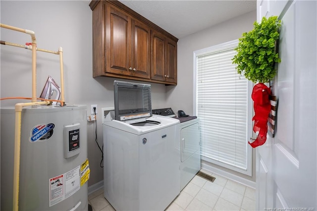 430 Rose Rd, Newton Grove, NC 28366 - clothes washing area with electric water heater, separate washer and dryer, cabinet space, and light tile patterned floors
