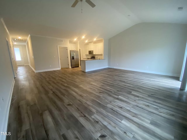 400 Access Dr, Youngsville, NC 27596 - unfurnished living room featuring a ceiling fan, dark wood-style flooring, baseboards, and lofted ceiling