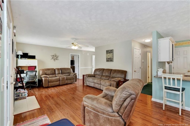 1501 E 6th St, Lumberton, NC 28358 - living area with wood finished floors, ceiling fan, and baseboards