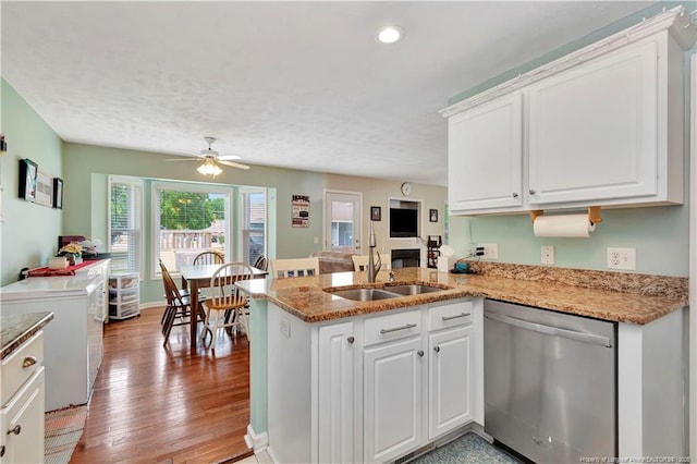 1501 E 6th St, Lumberton, NC 28358 - kitchen with dishwasher, a sink, a peninsula, white cabinets, and recessed lighting