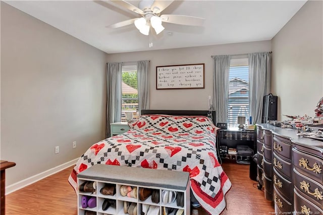 1501 E 6th St, Lumberton, NC 28358 - bedroom with wood finished floors, a ceiling fan, and baseboards