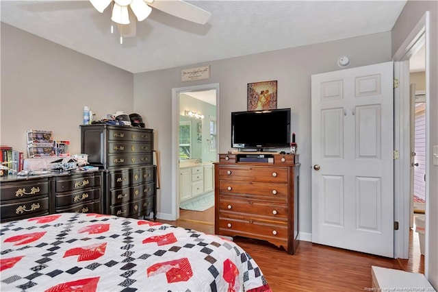 1501 E 6th St, Lumberton, NC 28358 - bedroom featuring wood finished floors, baseboards, ceiling fan, and connected bathroom