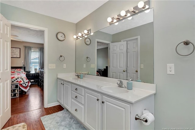 1501 E 6th St, Lumberton, NC 28358 - full bathroom featuring ensuite bath, wood finished floors, double vanity, and baseboards