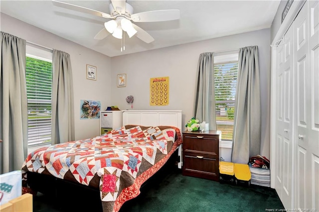 1501 E 6th St, Lumberton, NC 28358 - bedroom featuring a closet, dark carpet, multiple windows, and ceiling fan