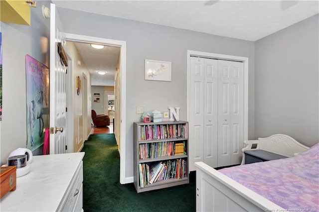 1501 E 6th St, Lumberton, NC 28358 - bedroom with dark carpet, a closet, and baseboards