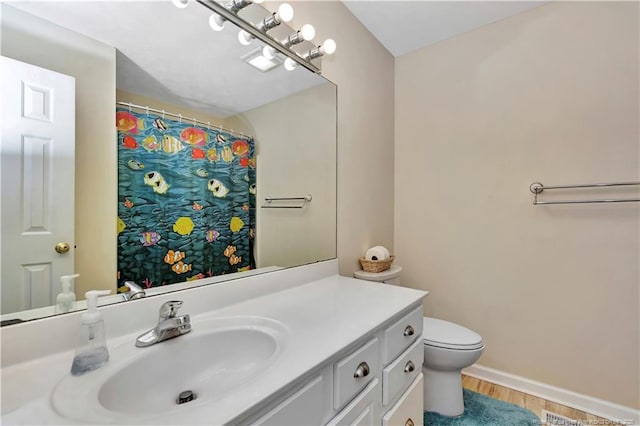 1501 E 6th St, Lumberton, NC 28358 - bathroom featuring toilet, vanity, wood finished floors, baseboards, and curtained shower