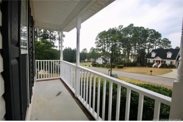 balcony featuring covered porch