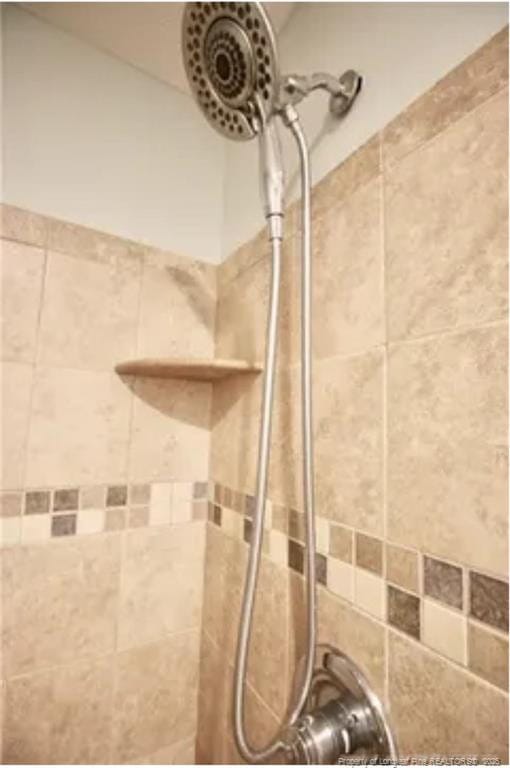 bathroom view of tiled shower