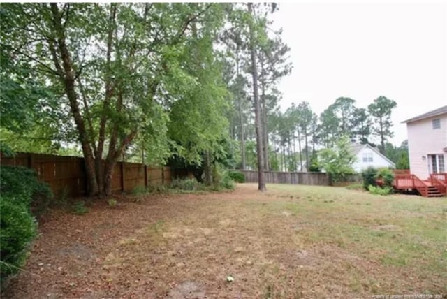 view of yard featuring a wooden deck