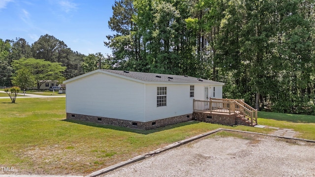 4870 Dogwood Dr, Battleboro, NC 27809 - view of side of home with crawl space, a wooden deck, a yard, and stairway