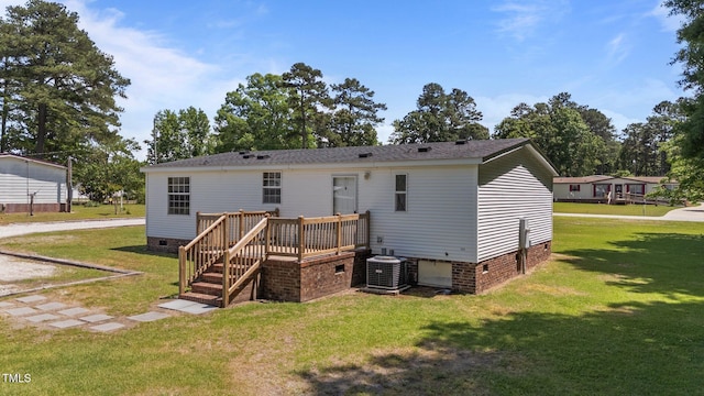 4870 Dogwood Dr, Battleboro, NC 27809 - rear view of property featuring crawl space, a lawn, a deck, and central air condition unit