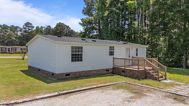 4870 Dogwood Dr, Battleboro, NC 27809 - back of house with crawl space, a wooden deck, a lawn, stairway, and view of scattered trees