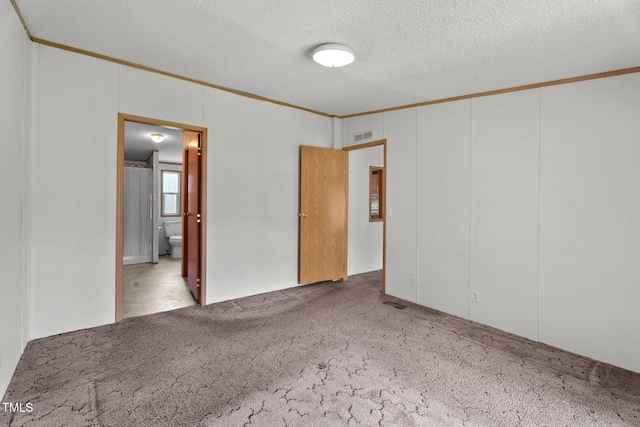 4870 Dogwood Dr, Battleboro, NC 27809 - carpeted empty room with ornamental molding and a textured ceiling
