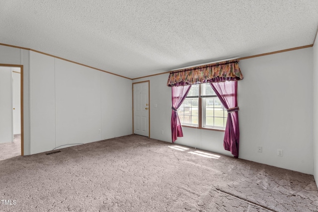 4870 Dogwood Dr, Battleboro, NC 27809 - carpeted empty room featuring crown molding and a textured ceiling