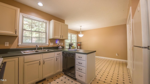133 Parkhaven Ln, Garner, NC 27529 - kitchen featuring dishwasher, a sink, dark countertops, light flooring, and freestanding refrigerator