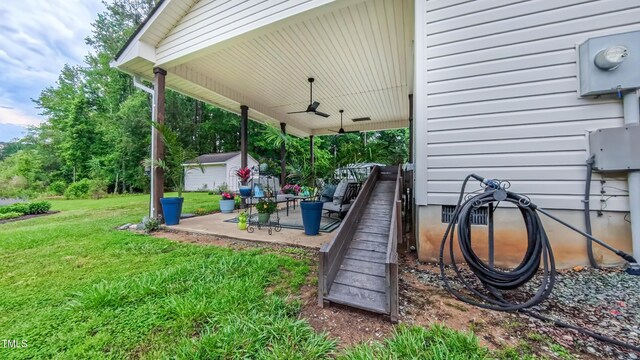 view of patio featuring ceiling fan