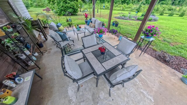 view of patio with outdoor lounge area and outdoor dining area