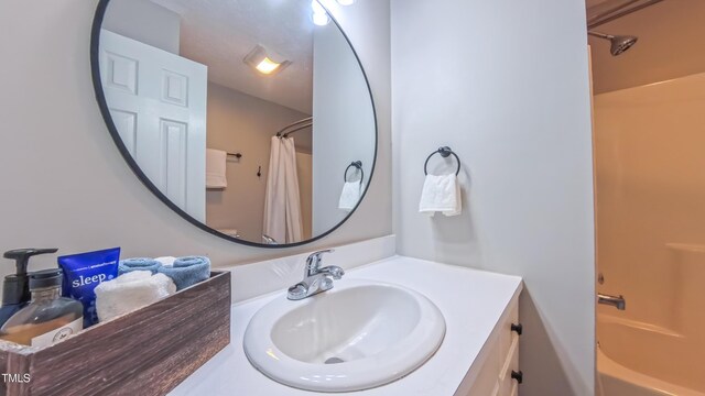 full bath with vanity and shower / bathtub combination with curtain