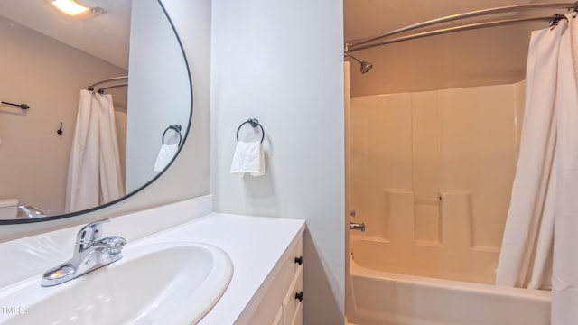 bathroom featuring vanity and shower / tub combo with curtain