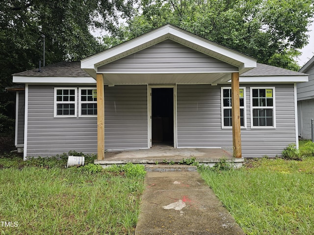 109 Raynor St, Goldsboro, NC 27530 - bungalow-style house featuring covered porch and a shingled roof