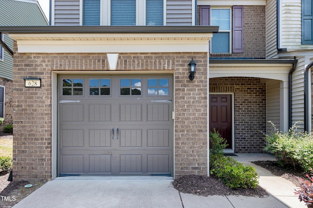 garage with concrete driveway