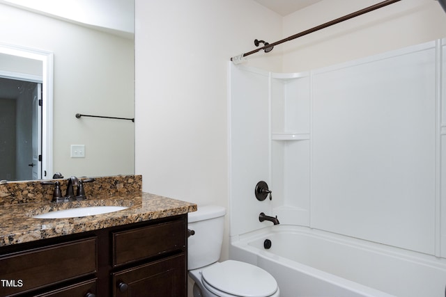 bathroom with toilet, bathing tub / shower combination, and vanity