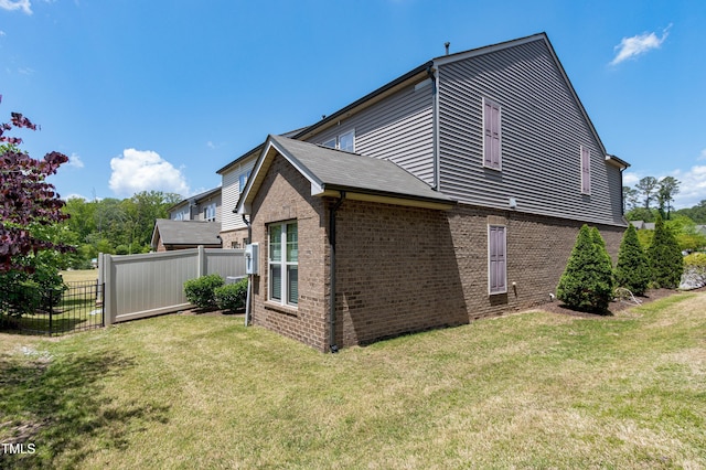 view of property exterior featuring brick siding