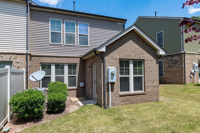 rear view of property featuring brick siding