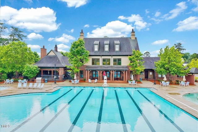 community pool featuring a patio area