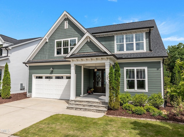 192 Logbridge Rd, Chapel Hill, NC 27516 - craftsman inspired home featuring driveway, a porch, a garage, and roof with shingles
