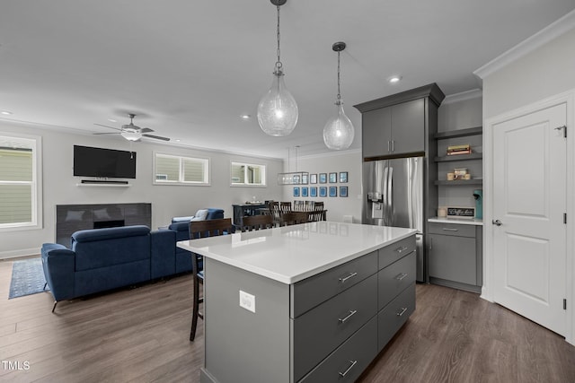 192 Logbridge Rd, Chapel Hill, NC 27516 - kitchen with gray cabinets, a kitchen breakfast bar, stainless steel refrigerator with ice dispenser, and recessed lighting