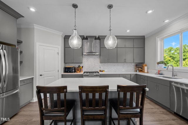 192 Logbridge Rd, Chapel Hill, NC 27516 - kitchen with appliances with stainless steel finishes, gray cabinets, wall chimney exhaust hood, a sink, and crown molding