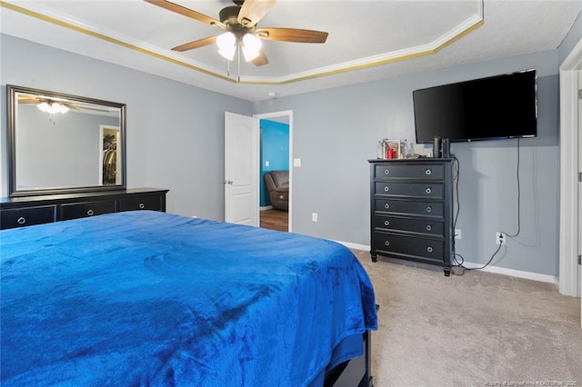1624 Citation Ct, Parkton, NC 28371 - bedroom with a tray ceiling, carpet floors, baseboards, and a ceiling fan