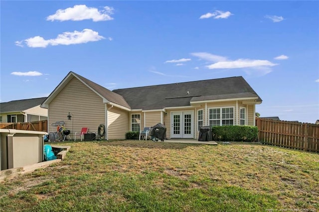 1624 Citation Ct, Parkton, NC 28371 - back of property featuring french doors and a patio area