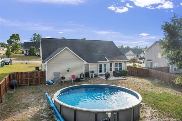 1624 Citation Ct, Parkton, NC 28371 - back of house with french doors, a fenced backyard, and a patio
