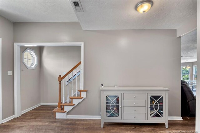 1624 Citation Ct, Parkton, NC 28371 - entryway with wood finished floors, a textured ceiling, and stairs