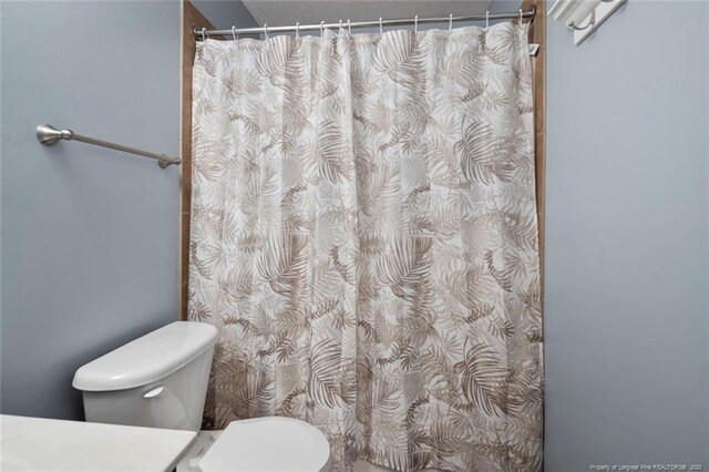 1624 Citation Ct, Parkton, NC 28371 - bathroom with a shower with curtain and vanity