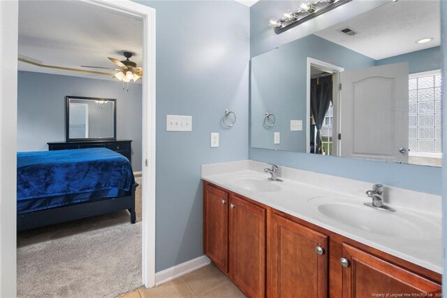 1624 Citation Ct, Parkton, NC 28371 - ensuite bathroom featuring double vanity, a ceiling fan, and tile patterned floors