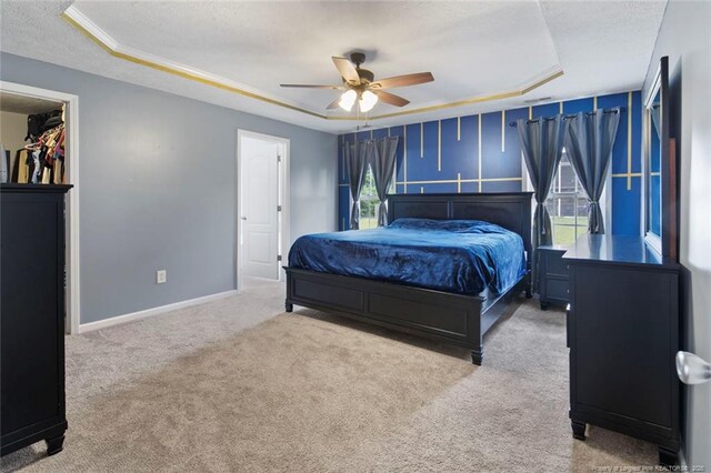 1624 Citation Ct, Parkton, NC 28371 - bedroom with a textured ceiling, a tray ceiling, carpet floors, and a ceiling fan