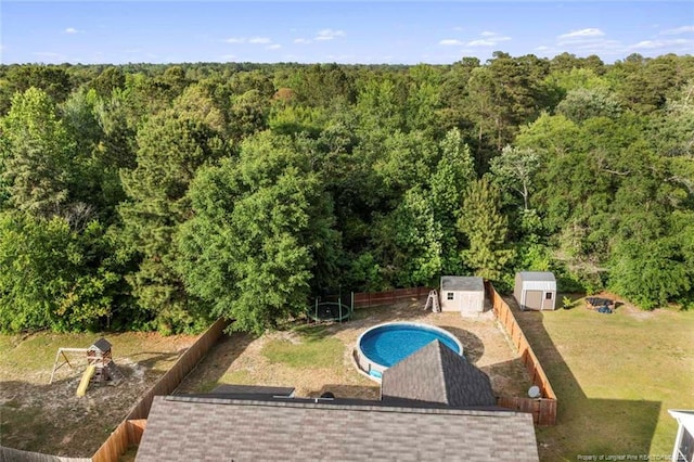 1624 Citation Ct, Parkton, NC 28371 - view from above of property featuring a forest and a pool