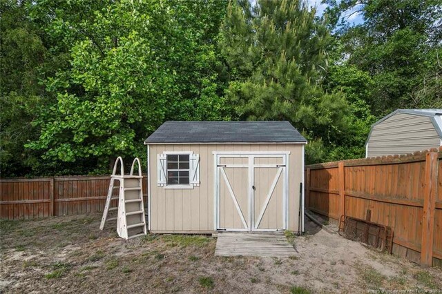 1624 Citation Ct, Parkton, NC 28371 - view of shed featuring a fenced backyard