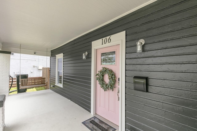 doorway to property featuring a porch