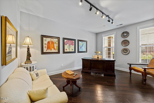 10520 Sablewood Dr Unit 103, Raleigh, NC 27617 - living room featuring rail lighting, plenty of natural light, baseboards, and dark wood-style floors