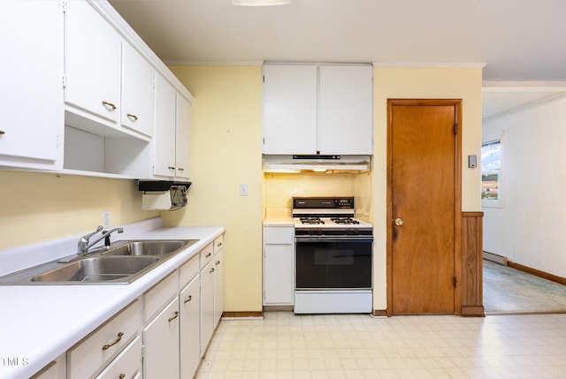 kitchen with white range with gas cooktop, a sink, under cabinet range hood, light flooring, and ornamental molding