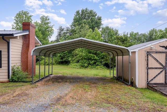 view of vehicle parking featuring a storage shed, a detached carport, and driveway