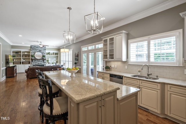 117 Synandra Ln, Holly Springs, NC 27540 - kitchen with dishwasher, a sink, a chandelier, a ceiling fan, and a kitchen island