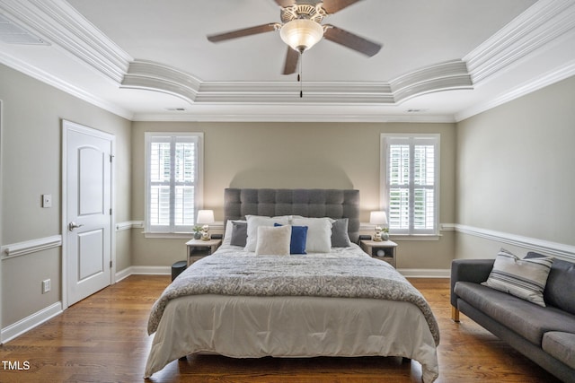 117 Synandra Ln, Holly Springs, NC 27540 - bedroom with a raised ceiling, ornamental molding, wood finished floors, and baseboards