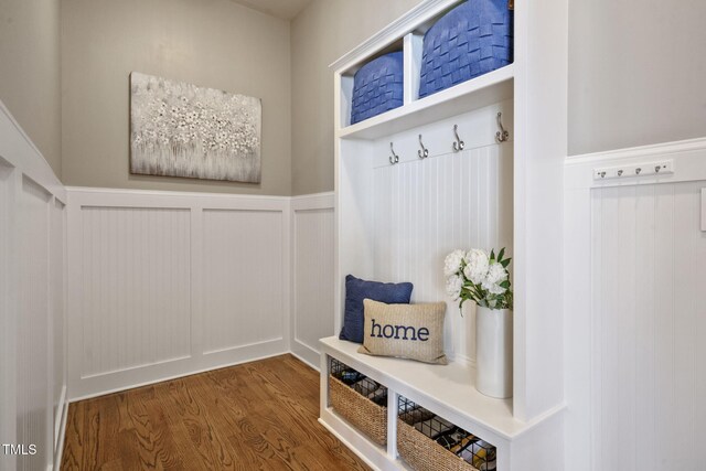 117 Synandra Ln, Holly Springs, NC 27540 - mudroom with wood finished floors, a wainscoted wall, and a decorative wall